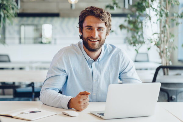 White bearded man Businessman in shirt working on his laptop in an office
