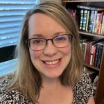Katy Meeks in Library Office in front of the window