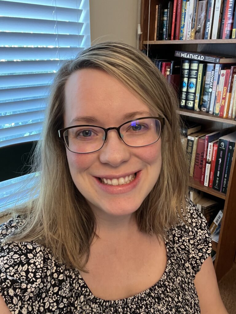 Katy Meeks in Library Office in front of the window